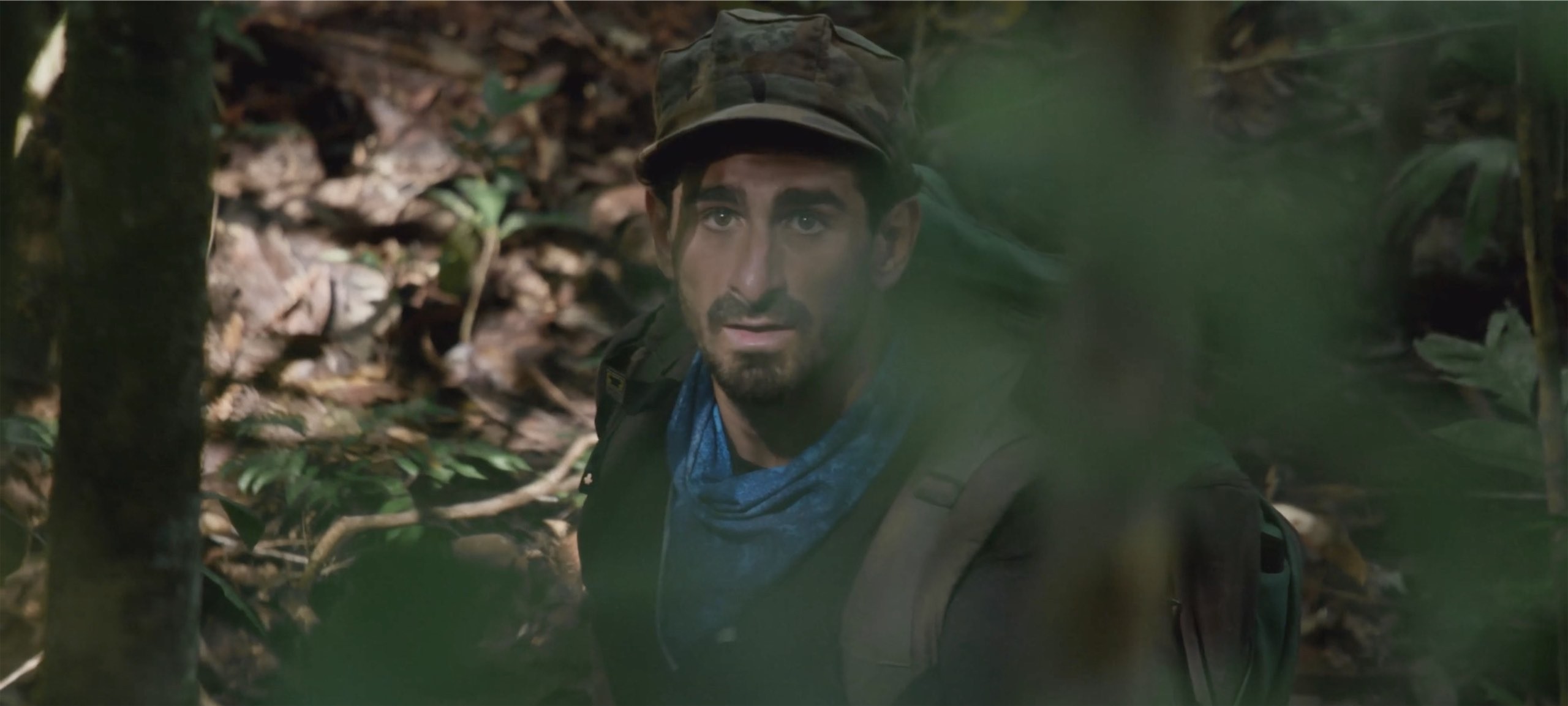 This image shows Paul Rosolie with a blue scarf looking at the camera.jpg